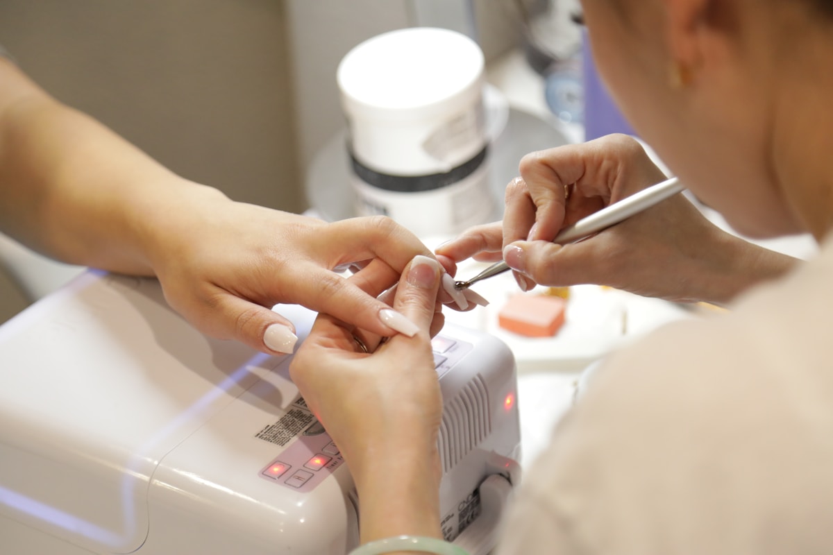 Woman getting her nails done at a nail salon